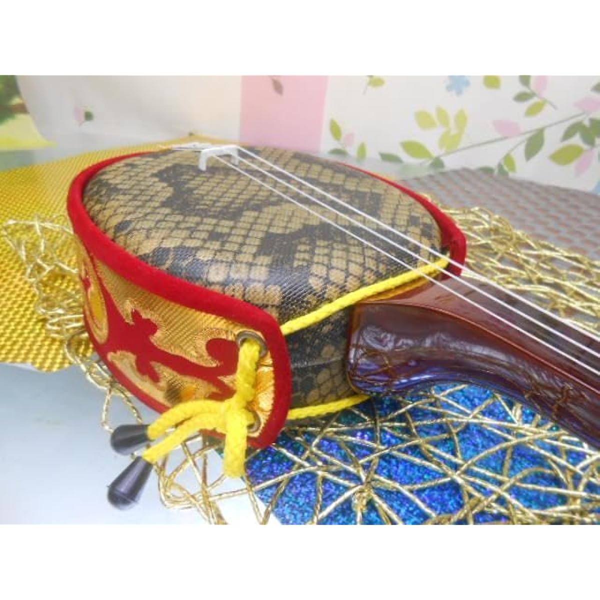 A small Okinawan sanshin with artificial skin for both adults and children