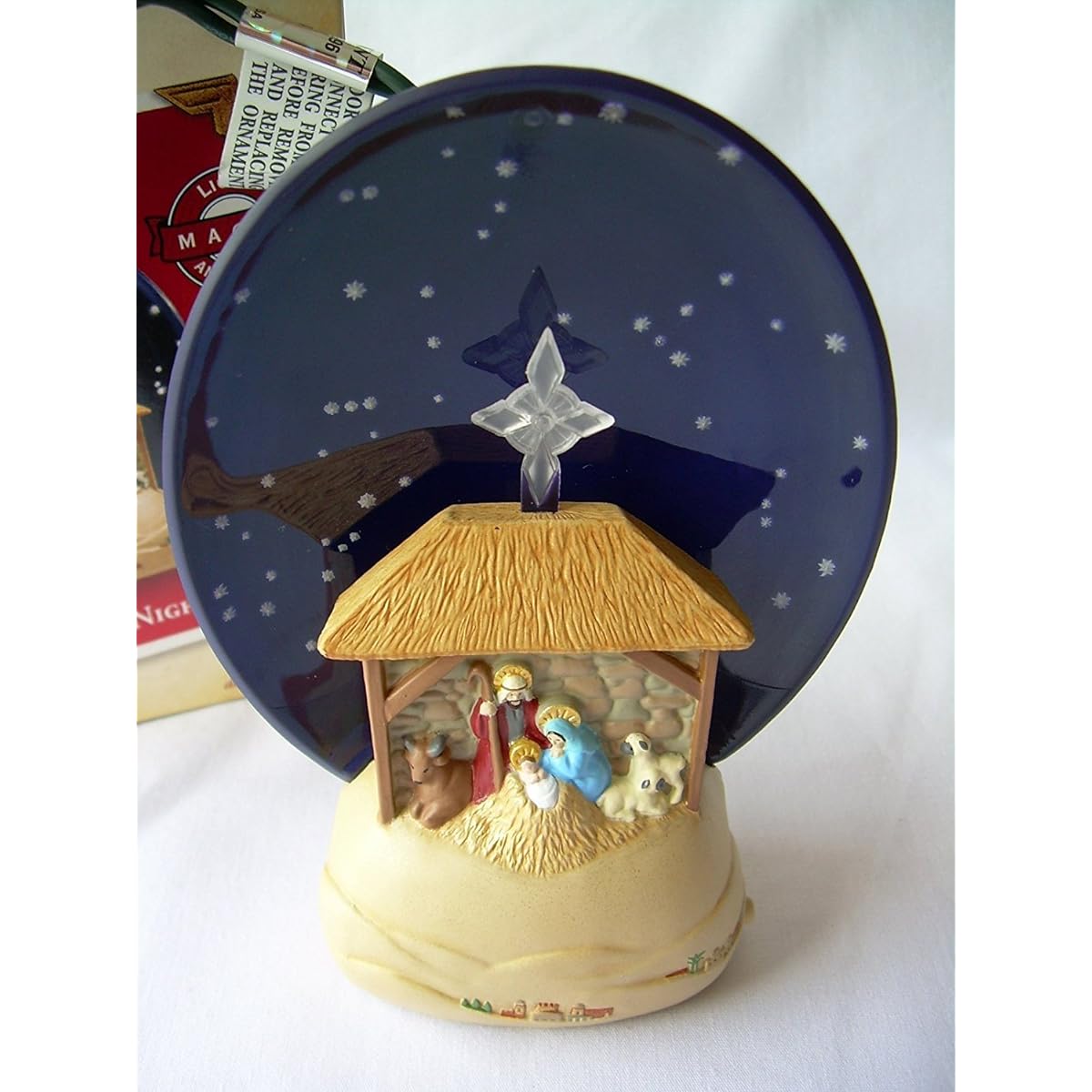 Silent Night Nativity 2004 Hallmark Magic Ornament QLX7591