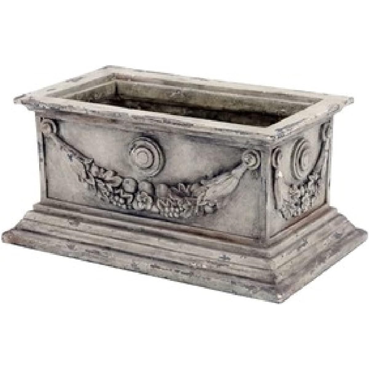 A flower pot that goes well with greenery and flowers.