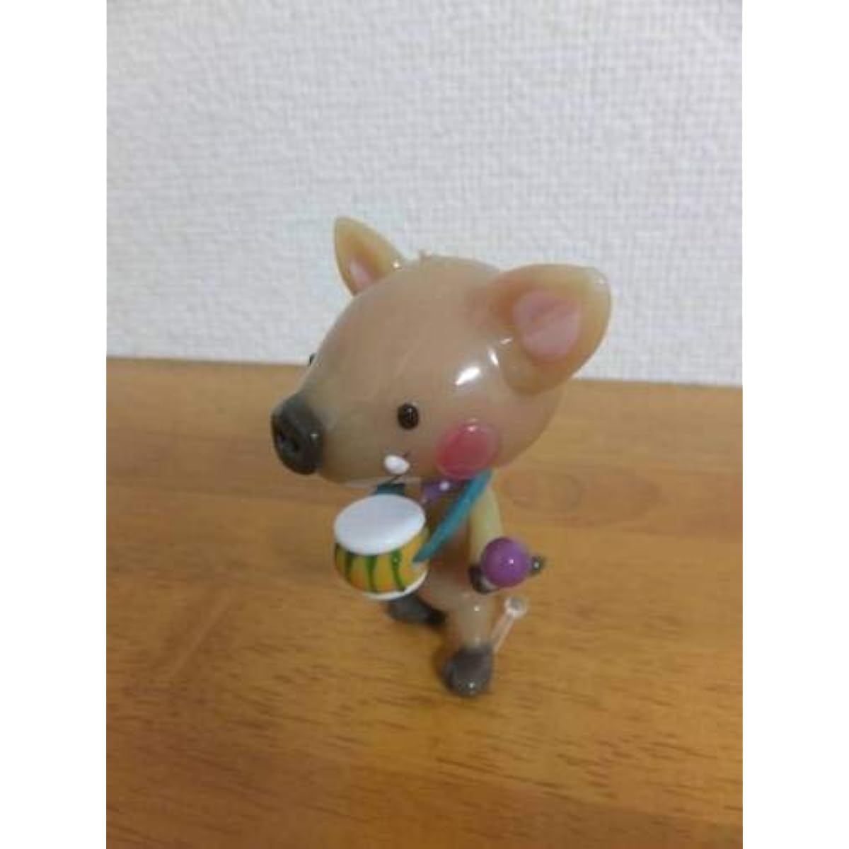 Popular artist Tomoko Iwasaki's glasswork: A wild boar playing a drum