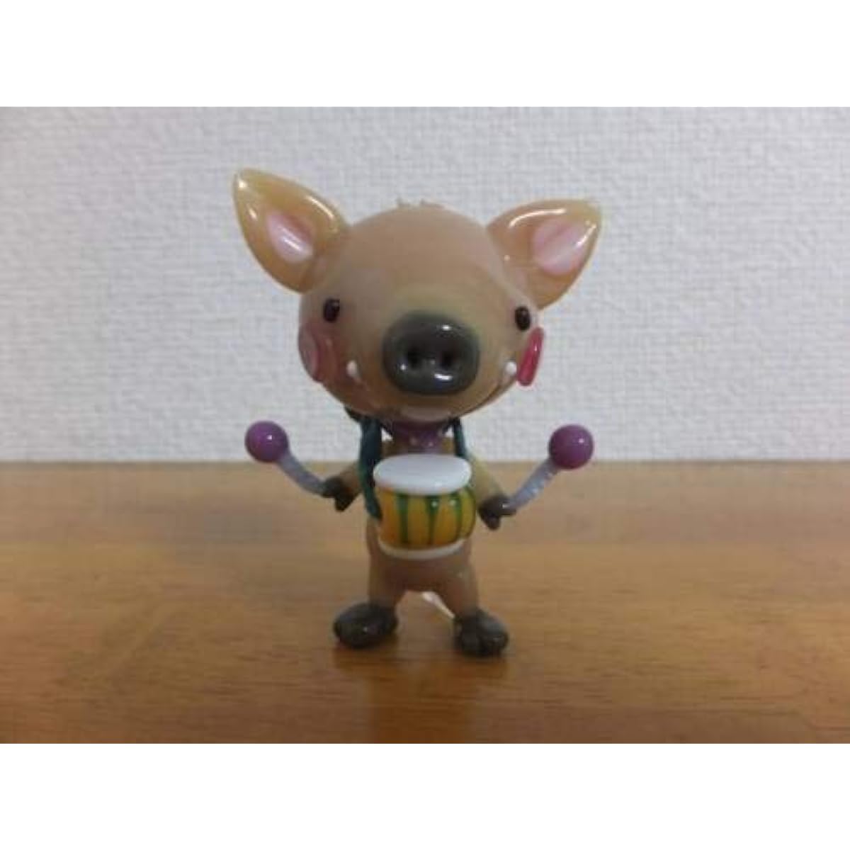 Popular artist Tomoko Iwasaki's glasswork: A wild boar playing a drum
