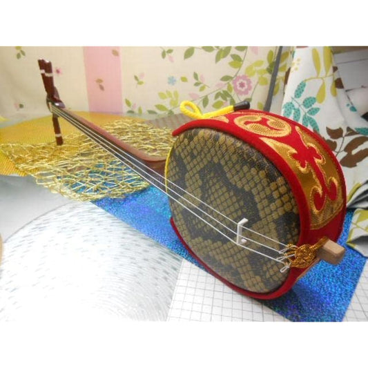 A small Okinawan sanshin with artificial skin for both adults and children