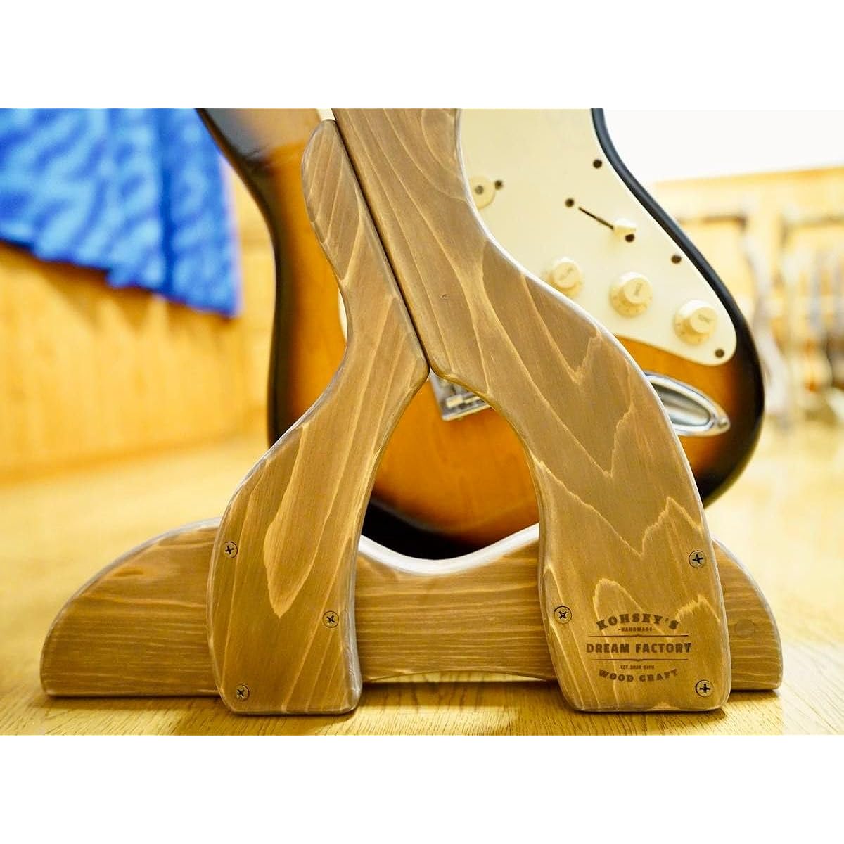 Wooden guitar stand (with protective finish) with genuine leather belt to prevent tipping over