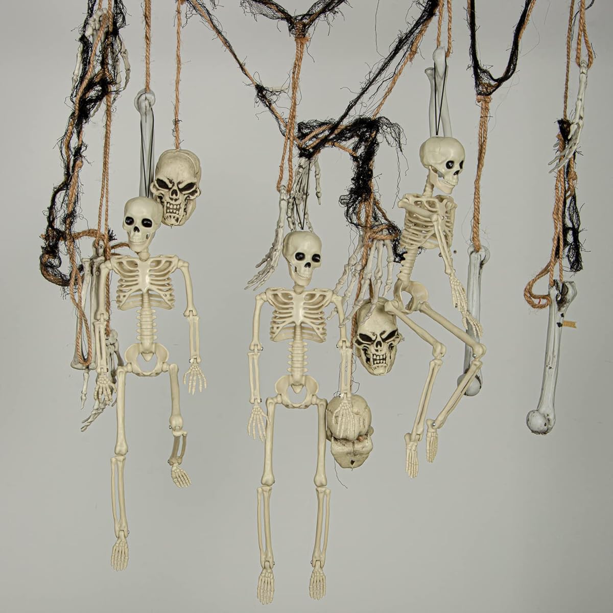 Posable Halloween Skeleton 4 Pieces 16 Inch Plastic Full Body Halloween Skull Skeleton Decoration with Movable Joints Haunted House Prop Decoration