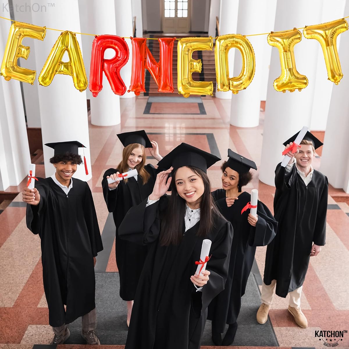 Earned it red and gold foil balloons.