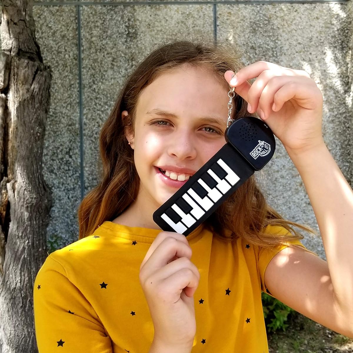 Rock And Roll It - Micro Piano.The Original Mini Black & White Keys Piano.Clip keychain for backpack.Portable musical instrument, silicone electronic finger piano pad.Batteries included