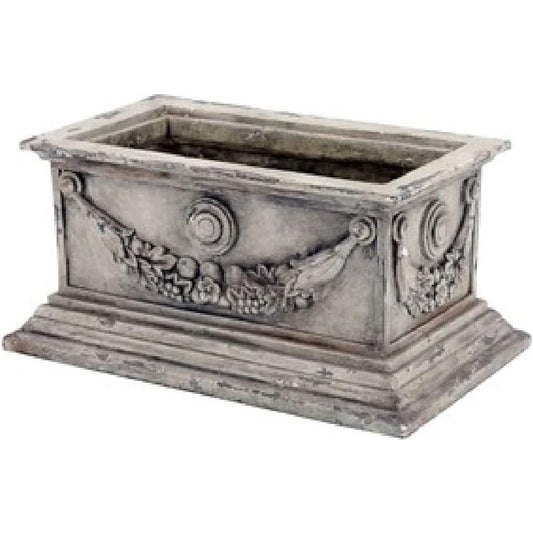 A flower pot that goes well with greenery and flowers.